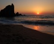 Papel de Parede Pôr-do-sol na Praia: Pedras