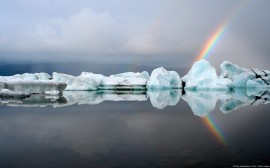 Papel de parede Arco-Íris Atrás de Icebergs